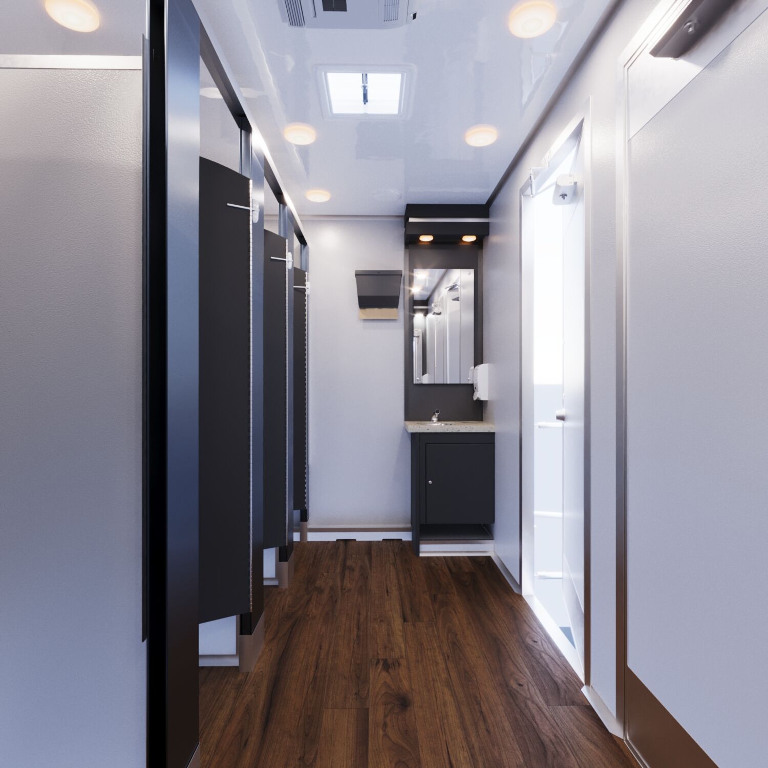 Full-Length View of Restroom Trailer Interior Perspective view of the interior of a luxury restroom trailer with doors open to individual stalls.